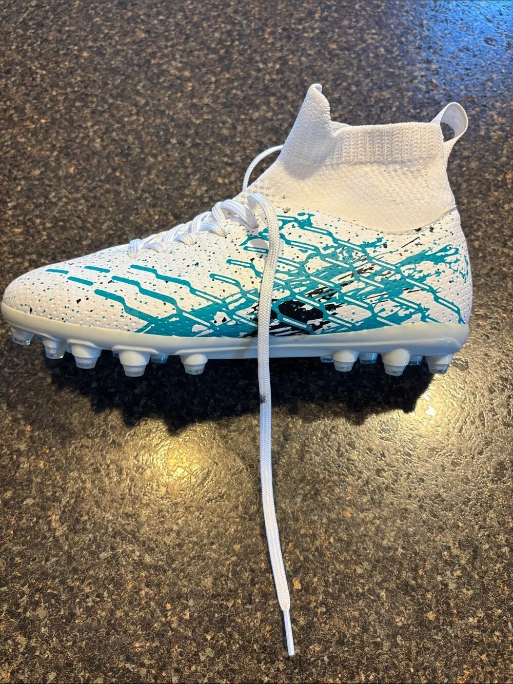Kids White Soccer Cleat with Teal Splash Accent